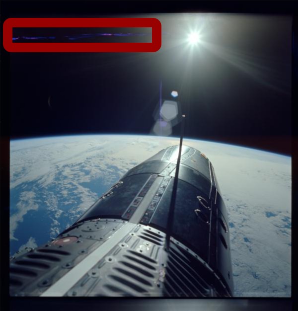 Selected Jun. 5, 1966: S66-38032. Commander (CDR) Eugene A. Cernans Extravehicular Activity (EVA) camera,standing in hatch over Pacific Ocean taken during the Gemini IX mission during orbit no. 31.